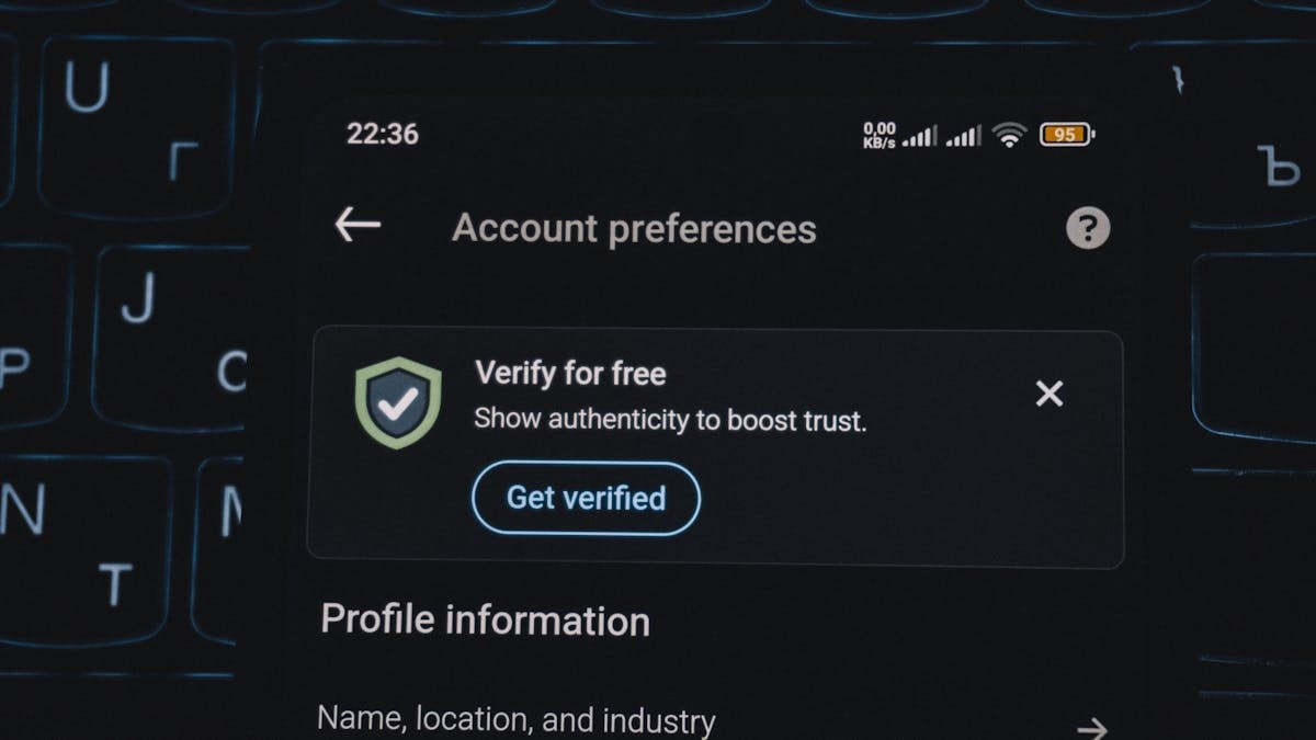 Close-up of a smartphone screen displaying account verification alert. Ideal for security and authenticity themes.